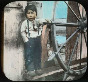 Image of Koo-i-tig-i-to by wheel, S.S. Roosevelt